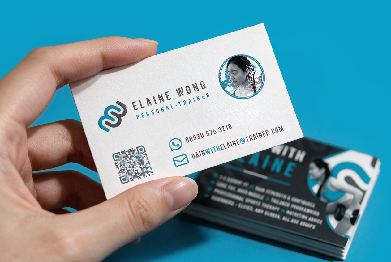 Elaine Wong Personal Trainer business card, held in hand, showing logo, contact details and QR code