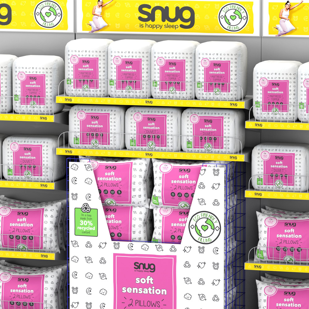 3D visual of a Snug Soft Sensation pillow dump bin among branded shelving