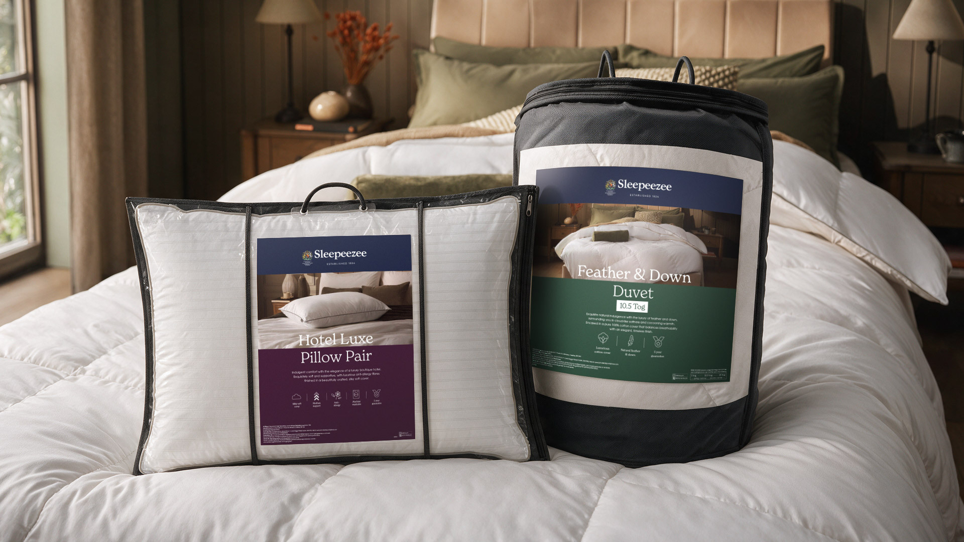 Sleepeezee Hotel Luxe Pillow Pair and Feather & Down Duvet packaging, styled on a bed