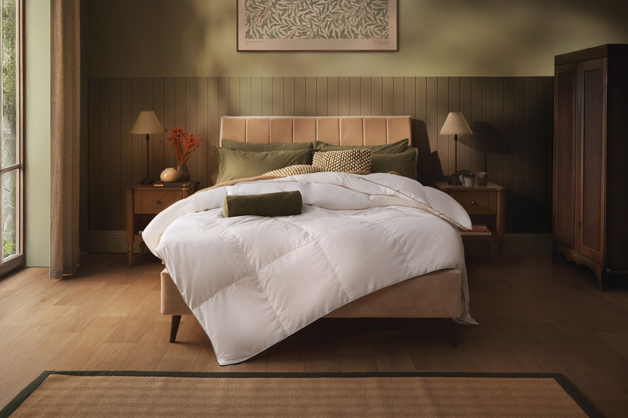Sleepeezee Feather & Down Duvet styled on a bed in a warm-toned bedroom