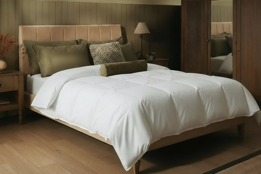 Side view of a bedroom styled with Sleepeezee bedding, wardrobe and bedside table in shot